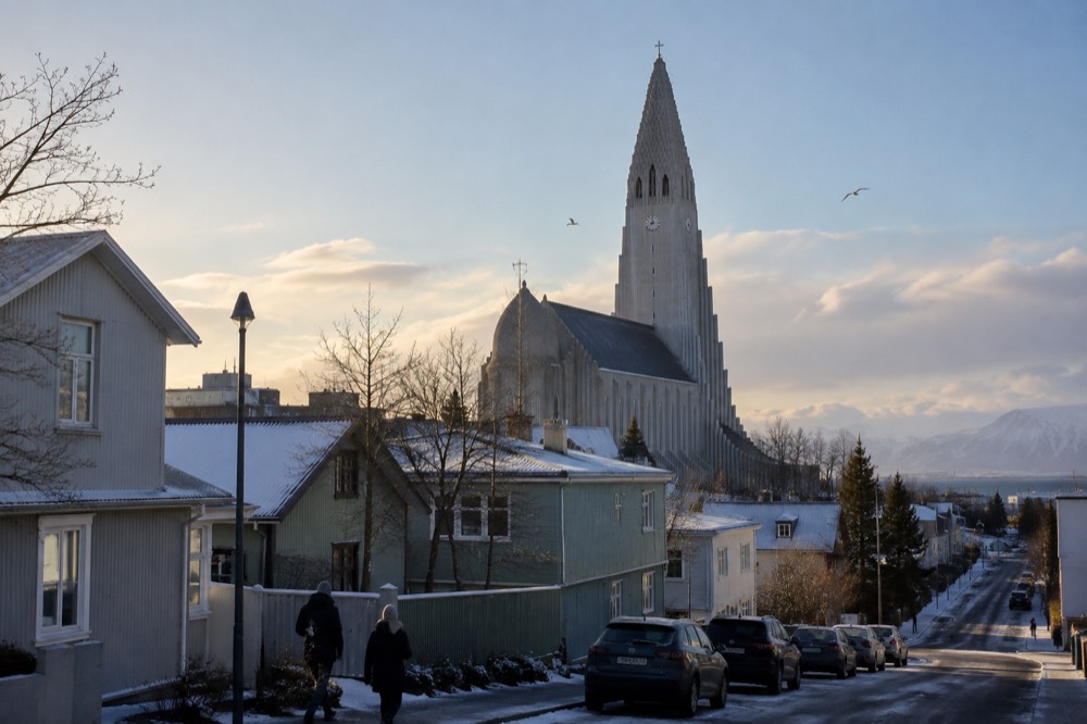 A church tower rising above rooftops in central Reykjavik