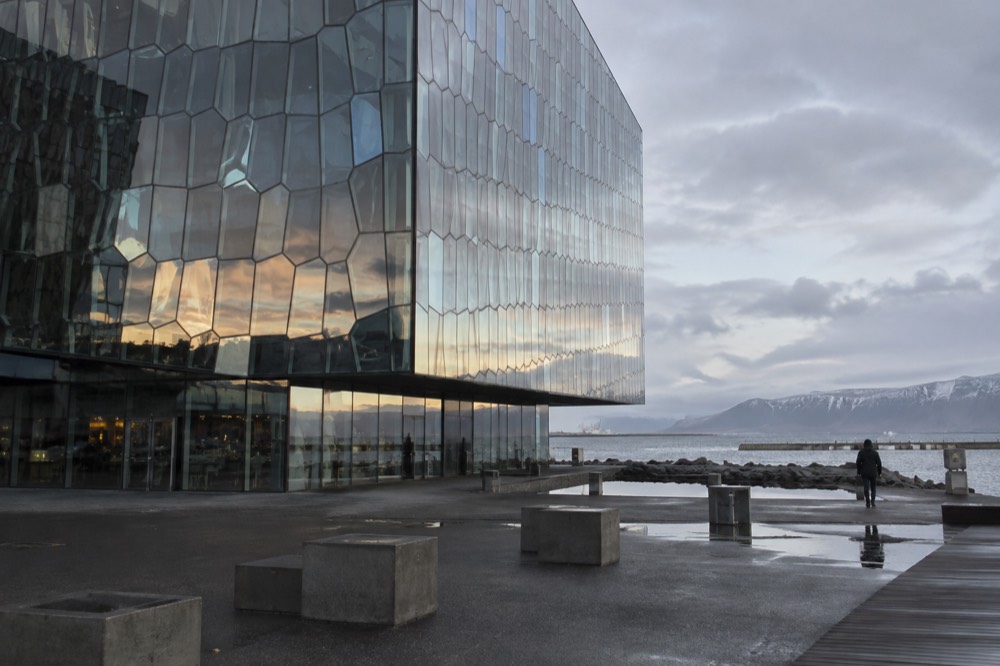 Harpa concert hall glass facade reflecting light over the waterfront