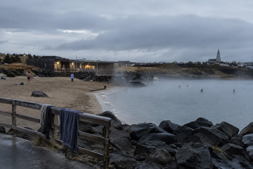 The geothermal Nautholsvik beach with its sandy cove and hot tub area beside the sea