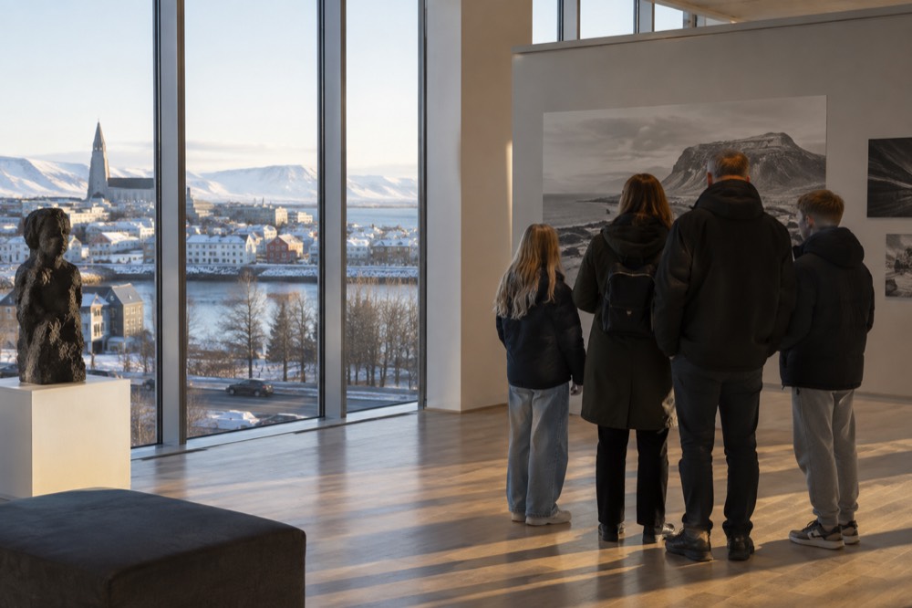 Family reading an exhibit panel in a bright museum gallery
