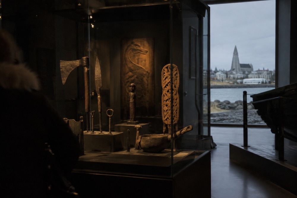 Artefacts displayed in a dimly lit museum exhibition case
